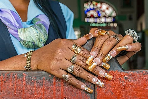 Cuba, Havana. Old Havana, Habana Vieja, Street vendors, fingernails, highly decorated. Fashion Print